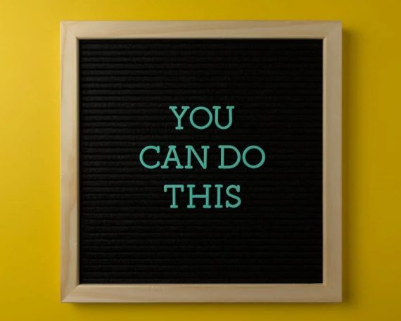 Inspirational message 'You Can Do This' displayed on a blackboard with a bold yellow backdrop.
